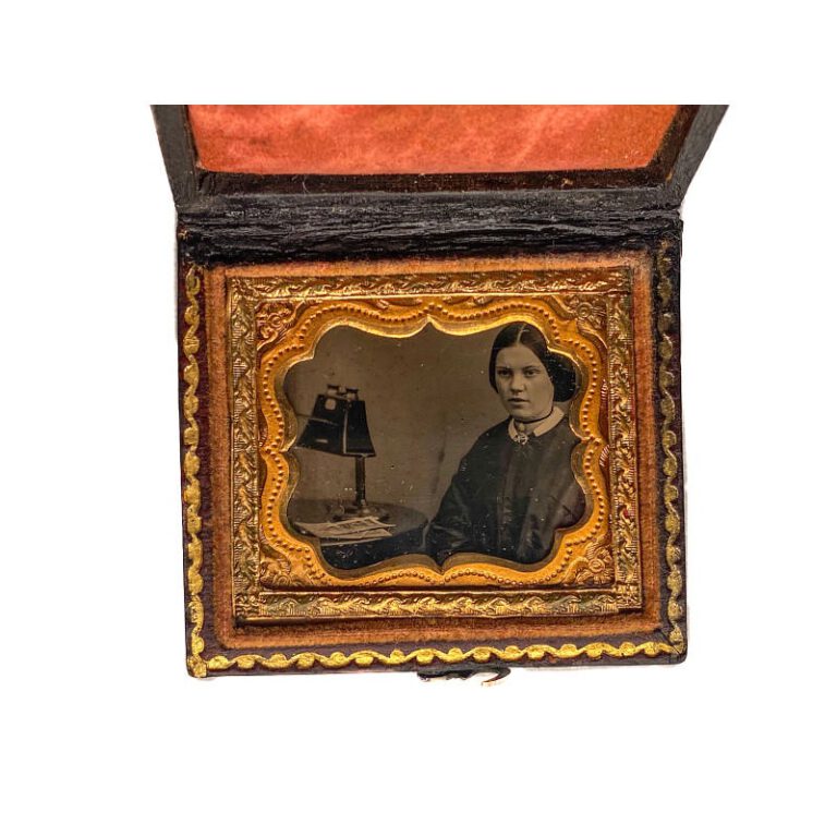 Woman with a stereoscope — cased Ambrotype